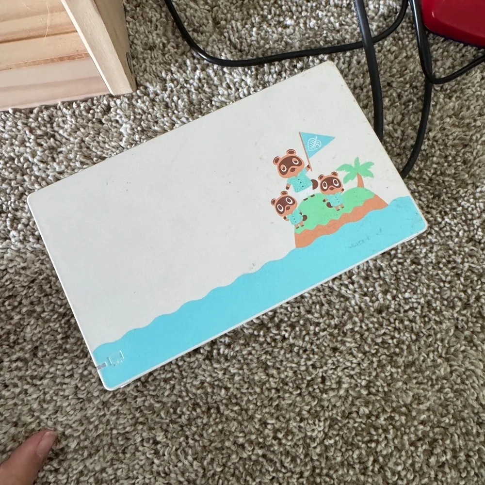 Limited edition animal crossing Nintendo switch. With racing wheel included